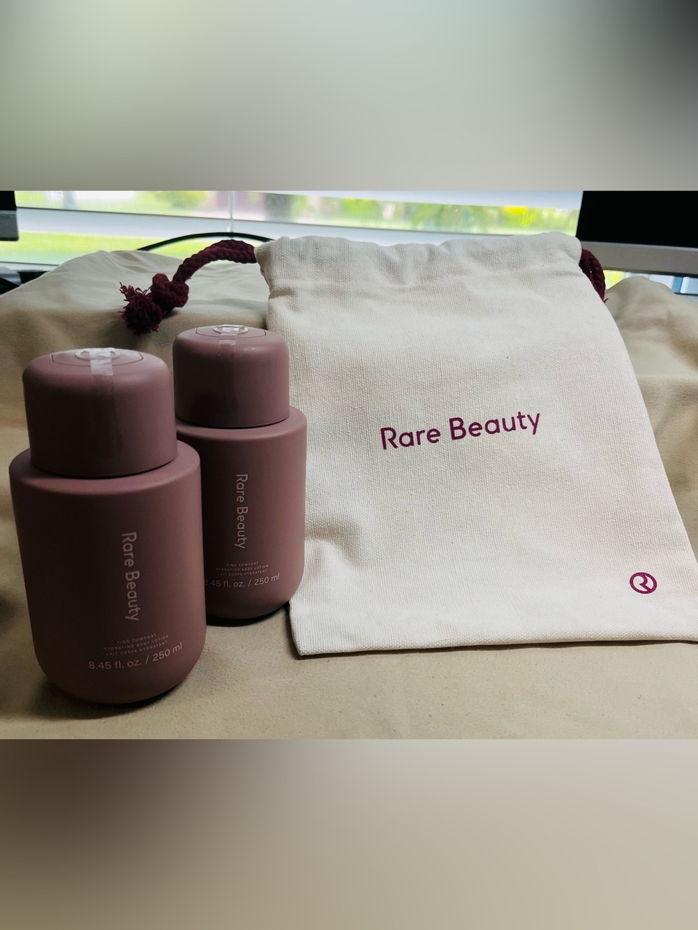 2 Rare Beauty Lotions - 8.45 oz each. Comes With Branded Drawstring Bag - NWT